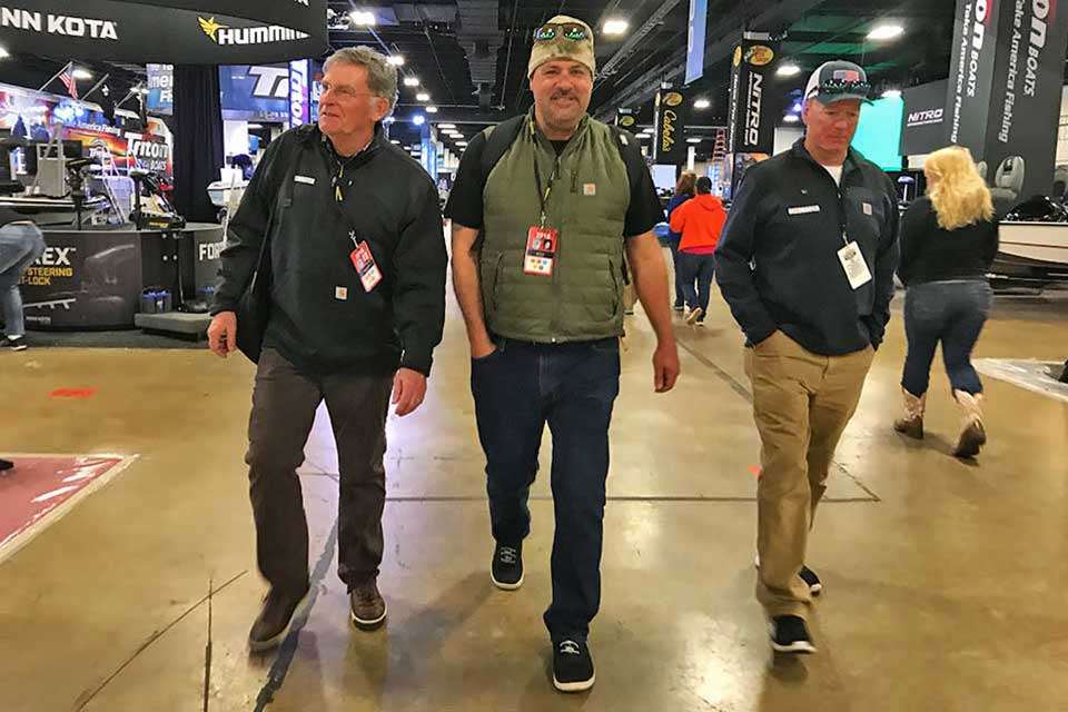 Tommy Sanders, Mark Zona and Davy Hite make their way through folks setting up booths at the Expo, stopping to visit with a select few. The longtime Bassmaster TV crew members were joined last year by Hite, a Classic champ and two-time Angler of the Year. Theyâre tag-teaming Bassmaster TV shows on ESPN2 and for the latest phenomena to hook bass fishing fans, Bassmaster LIVE.