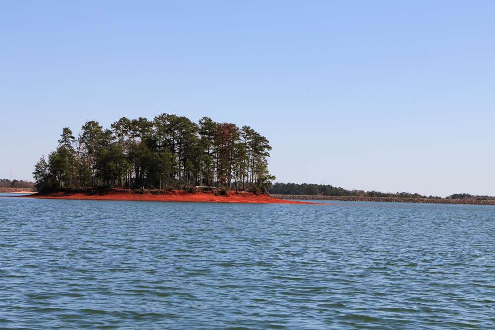 And some are bare red clay banks that taper off into the depths of the lake. 