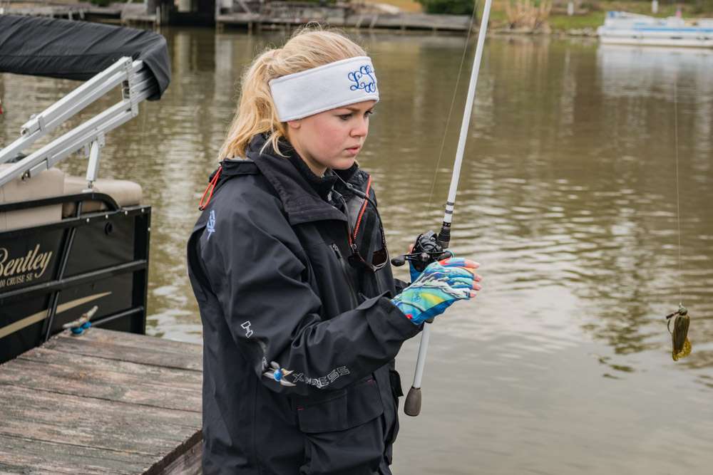 Laney Skipper from Rehobeth High School in Rehobeth, Alabama shows off her gloves as she finishes tying on a jig. 