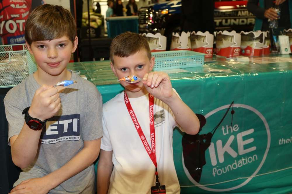 Dylan Cole, left, and Hunter Teens created their own custom bait color patterns at the Ike Foundation booth.