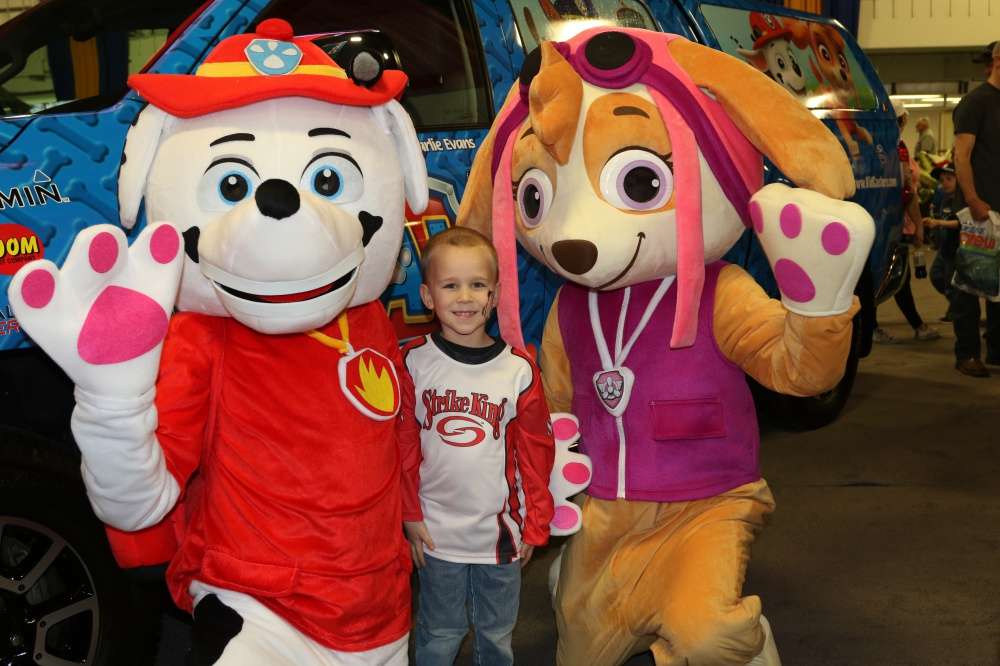 Four-year-old Tobias Noraas poses with the Paw Patrol.