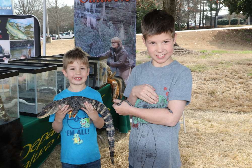 Griffin Marin held and alligator, while Ryan Marin entertained a young rat snake.