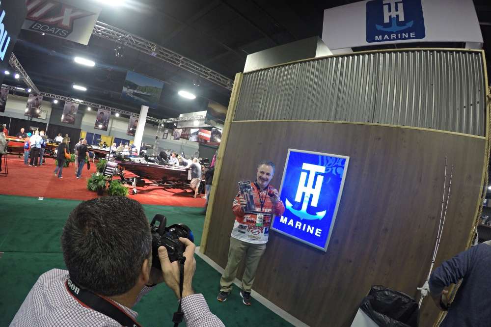 I caught David A. Brown shooting a photo with Mark Menendez at the TH Marine booth. 