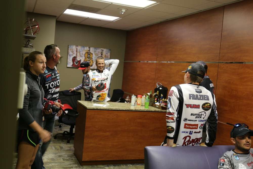 Backstage  the Super Six wait their turn to finish the weigh-in. 