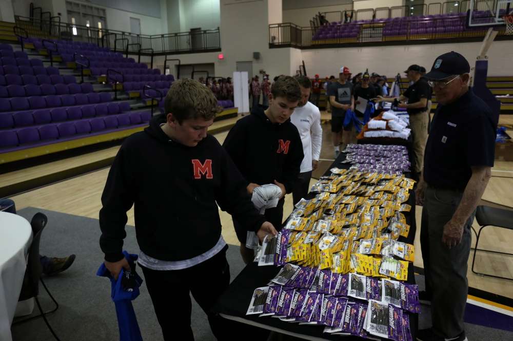 Morgan County High School (Madison, Georgia)'s Will Thomas and Landon Huff pick up some soft baits that could come in handy tomorrow. 