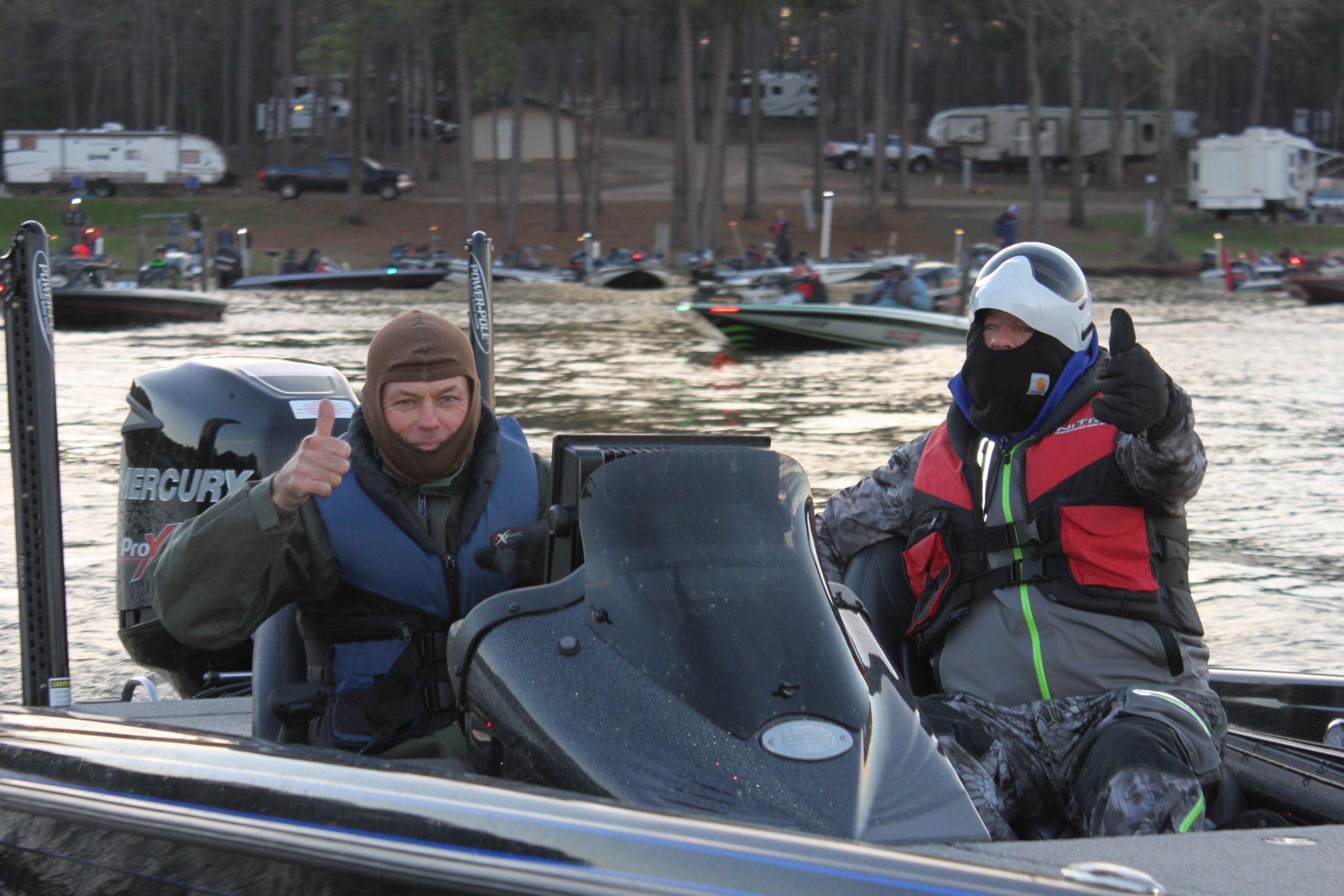 As do Keith Pace of Arkansas and David Patterson of Mississippi as they signal thumbs up on their way out to the reservoir.