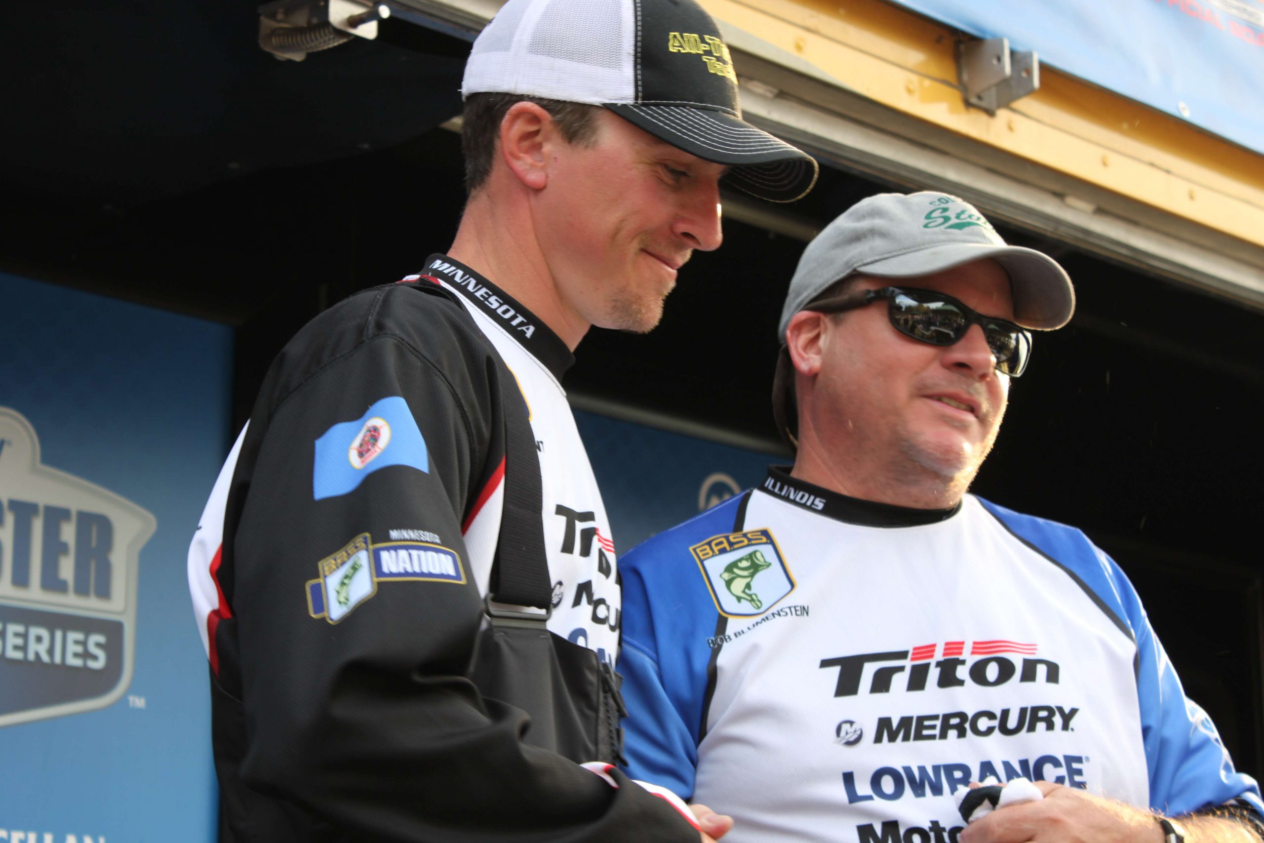 With the non-boater race settled, thereâs only one angler remaining at the scales. Illinois boater Bob Blumenstein, left, seized the lead with a tournament best 25-13 limit on Thursday. Here, heâs taken the stage as both he and Brant anxiously await the results.
