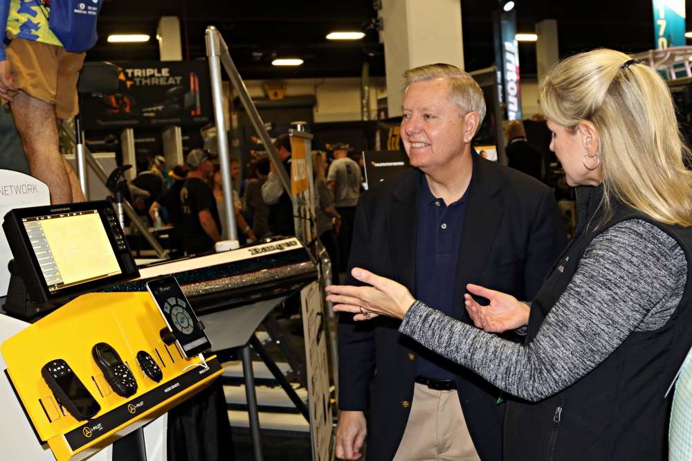 Judy Douglas of Humminbird/Minn Kota explains the newest technology to Senator Lindsey Graham.