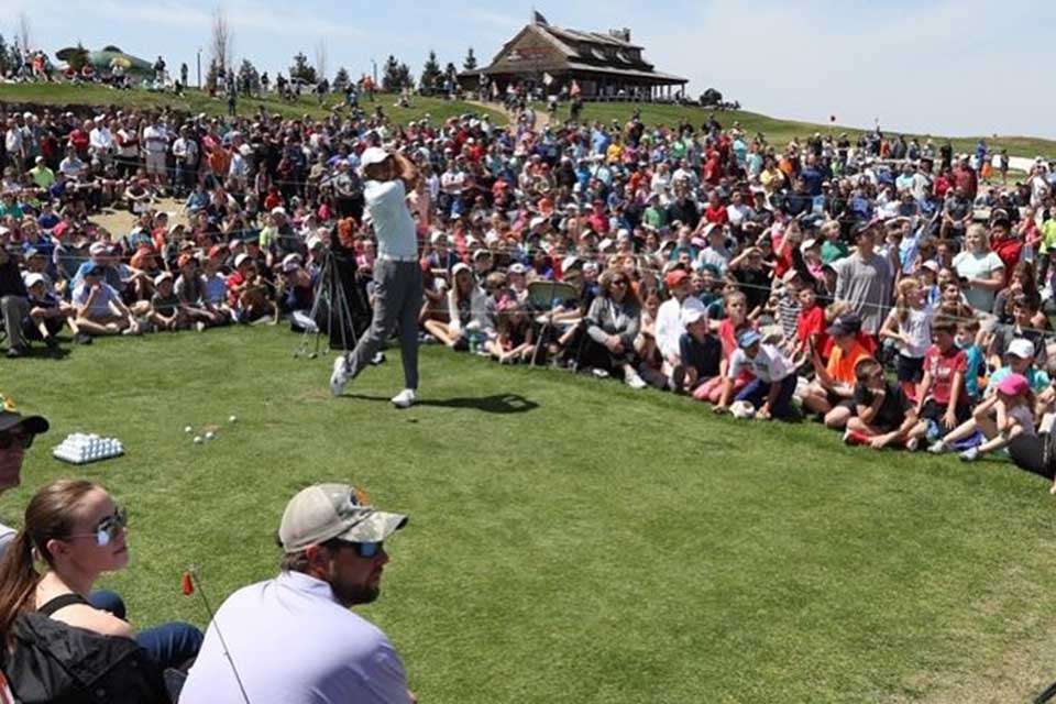 There were around 8,000 people, mostly children, at the clinic, which was hosted by Morris and Tracey Stewart, widow of local golf great Payne Stewart. Woods and Morris are creating the first public access course designed by Woodsâ new TGR Design operation. Called âPayneâs Valley,â the championship course is scheduled to open next year.