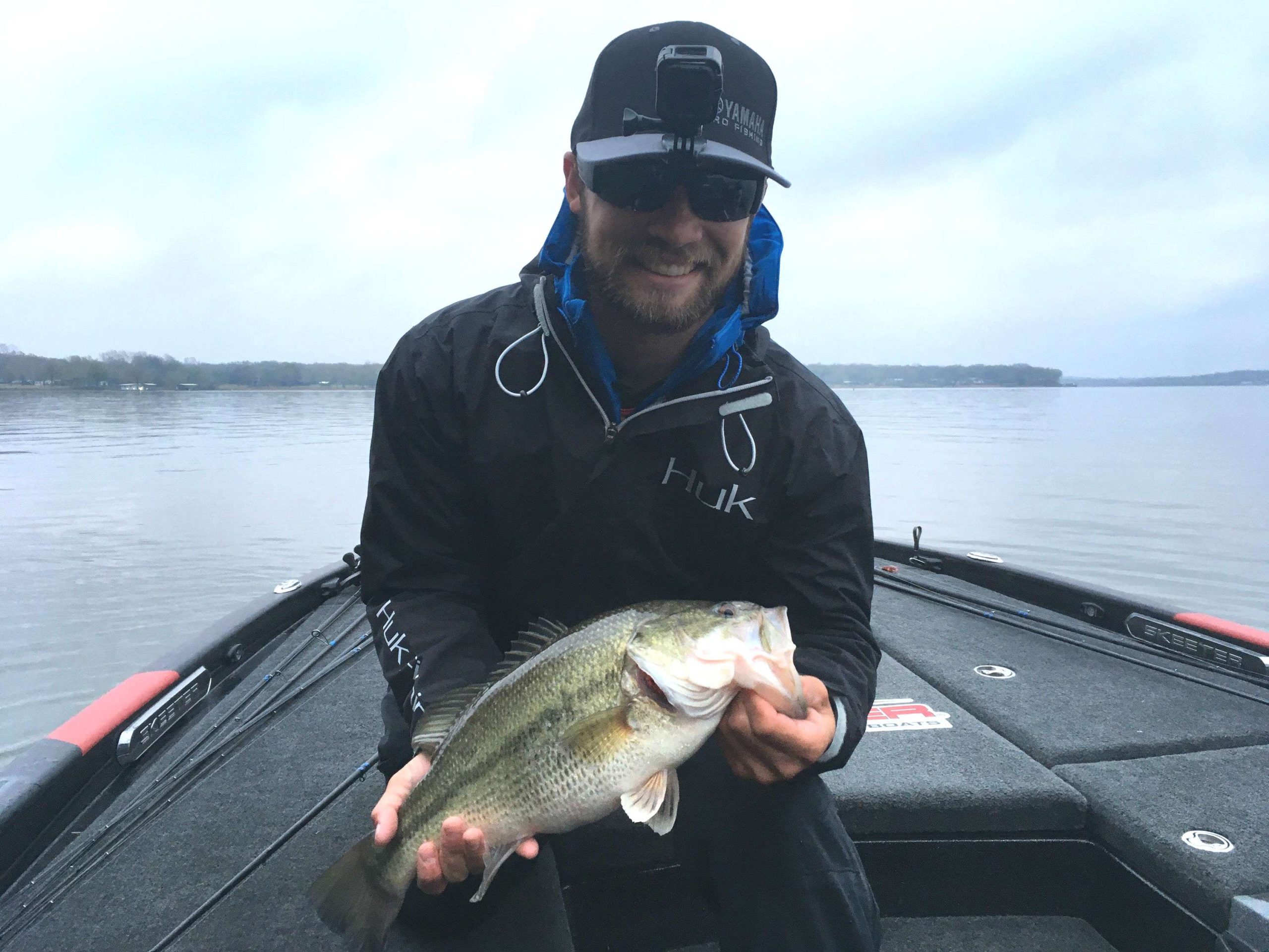 Brandon Palaniuk has his first bass on the livewell.  A fat 4-pounder that looks like it's ready to explode .

