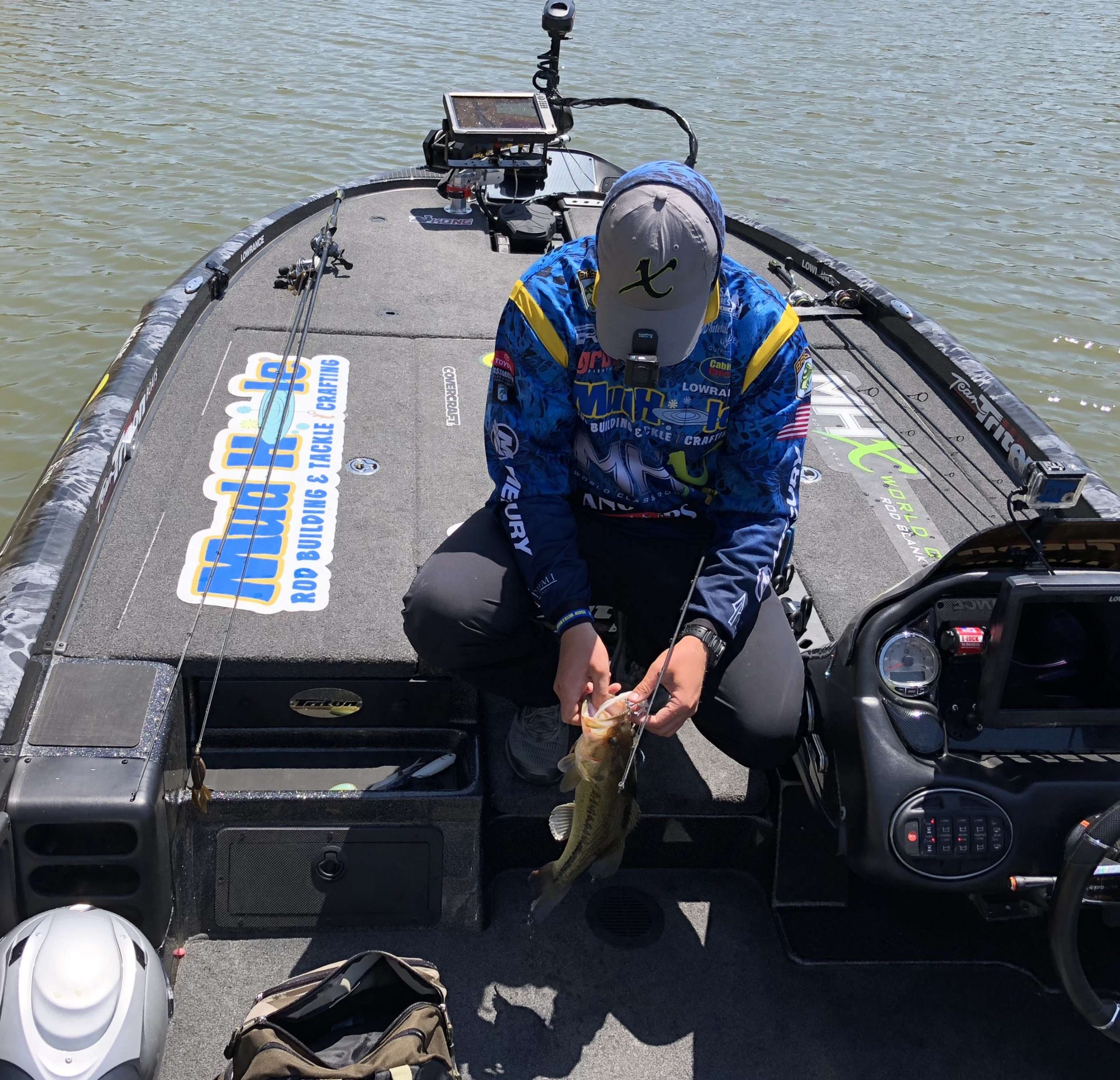 Bradley Roy is having a good day. He is tossing back 2 1/2 pound bass. What he needs is to have an great day. That is when he can cull 3 - 4 pound bass. 