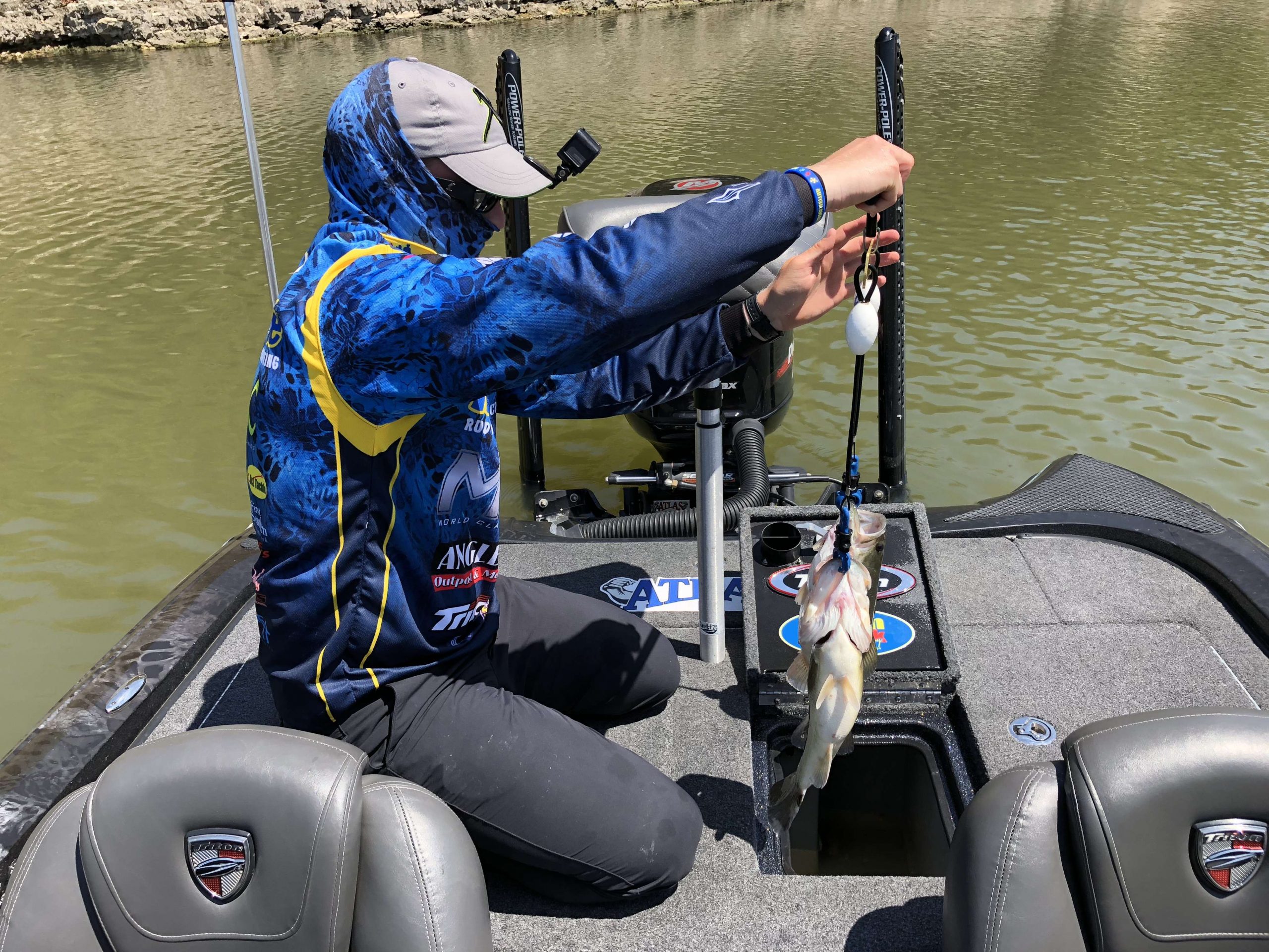 Bradley Roy is beaming a couple of bass. He uses a weight management culling system, but he still likes to check to be sure. He told his Marshal, âa couple of ounces might get me up another place or two.â That is  a $500 decision at this level of competition.