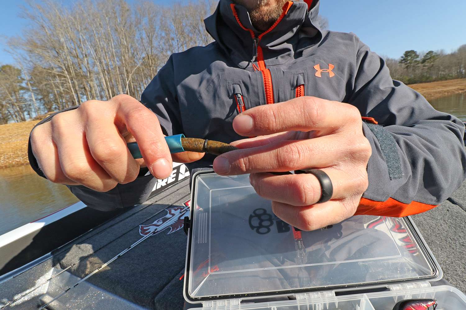 Slide the washer off the tube and onto the bait, somewhere near the middle. The hook can be slid underneath this washer without piercing the plastic bait, which will add substantial to the life of the lure. 