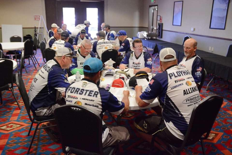 Montana anglers go through the tournament information sheets. 
