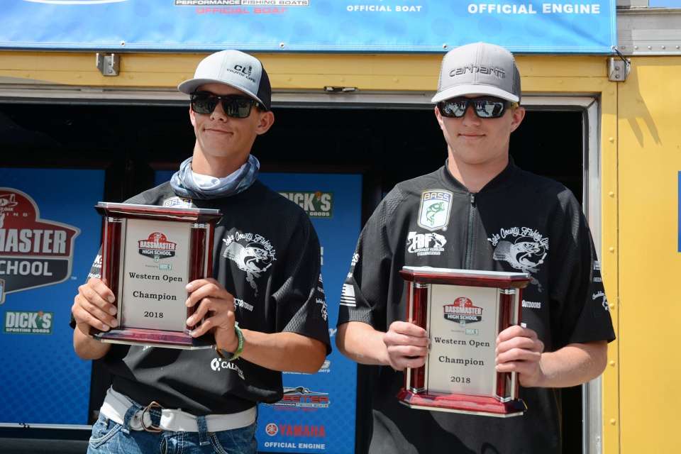 Reese and Goff with their winning plaques. 
