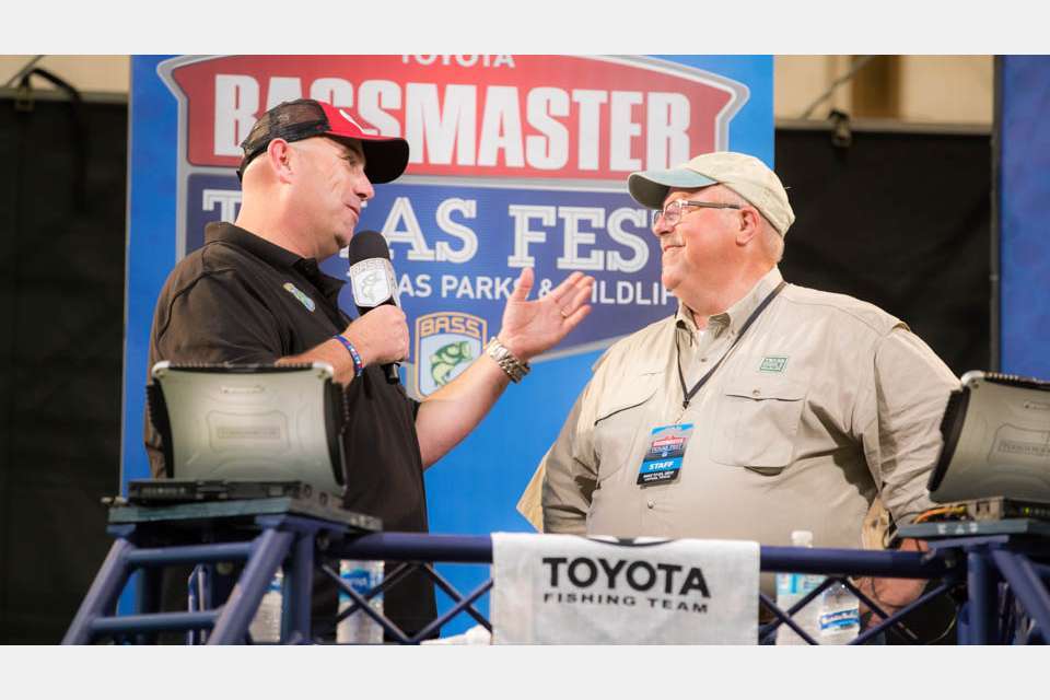 Dave Terre, Chief of Fisheries Management for the TPWD, speaks with Mercer during a weigh-in last year. Terre proudly announces that the bass tournaments have generated more than $2.75 million for fisheries projects since 2007, specifically the youth fishing and urban outreach programs.