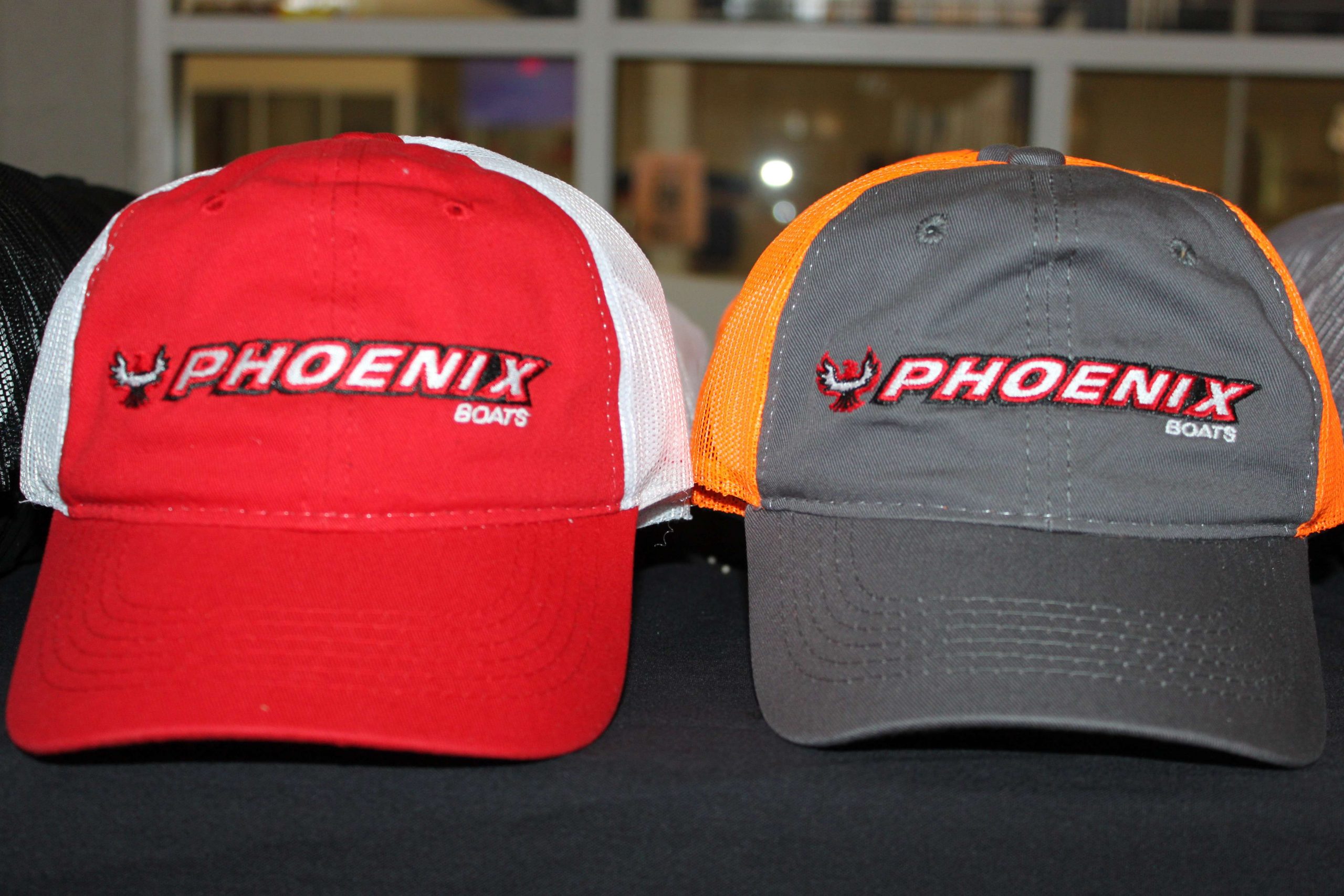 Phoenix Boats had stacks of brightly colored hats.