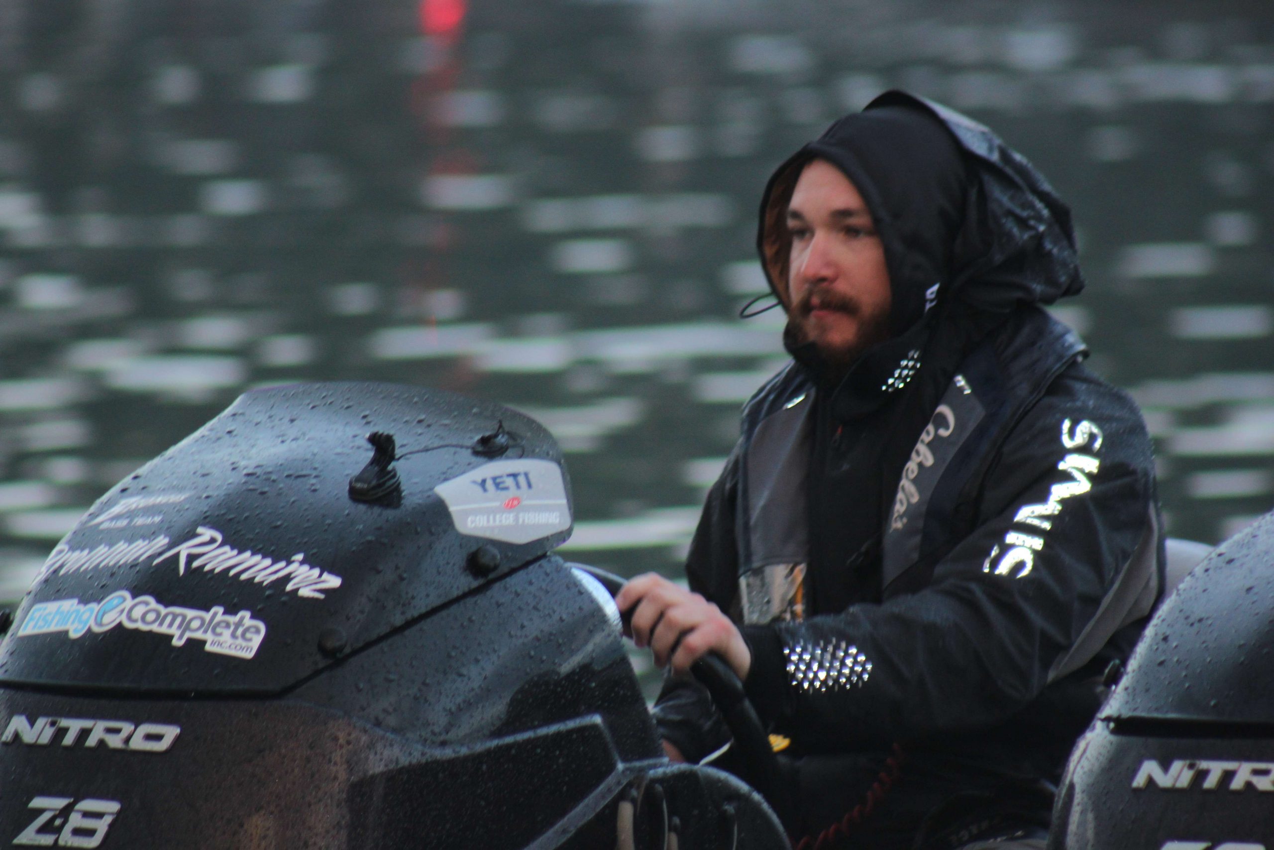 Anglers slipped into rain gear and pulled hoodies over their heads. 