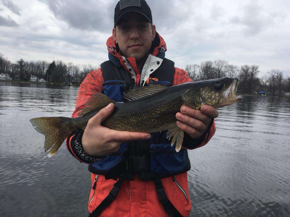 A walleye that was caught on the water, photographed and released.  This was the first time this soldier went out fishing.