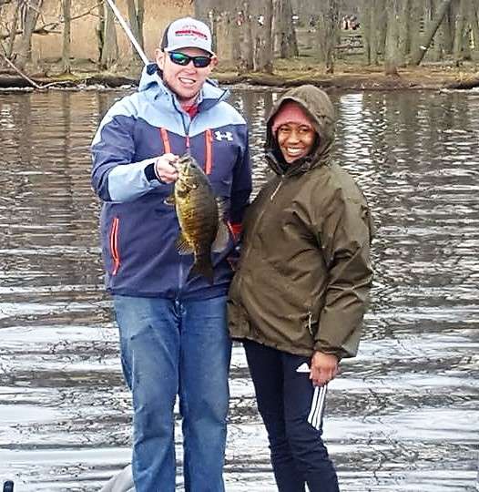 Patrick Carr and his soldier with a small mouth bass. Once again, this was the first time for this soldier to go fishing. She was not ready to hold the fish; however, she says she cannot wait to go again. 
