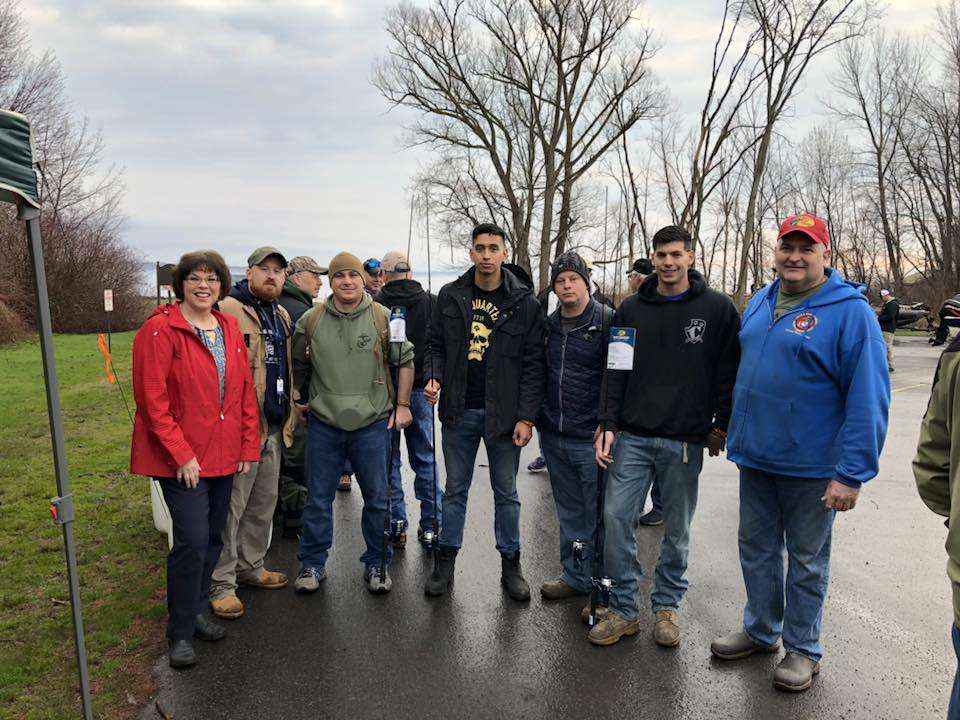 Lori and Rick Schneider, the parents of Cpl. Kyle Schneider, and a few of the soldiers who came out to fish.