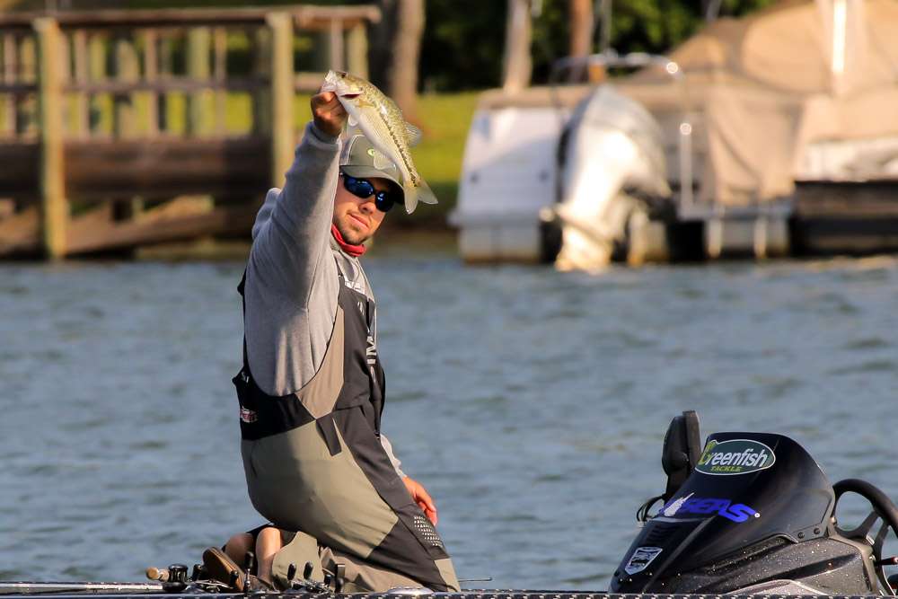 Hardy holds up a typical Lake Norman post-spawn spotted bass. 