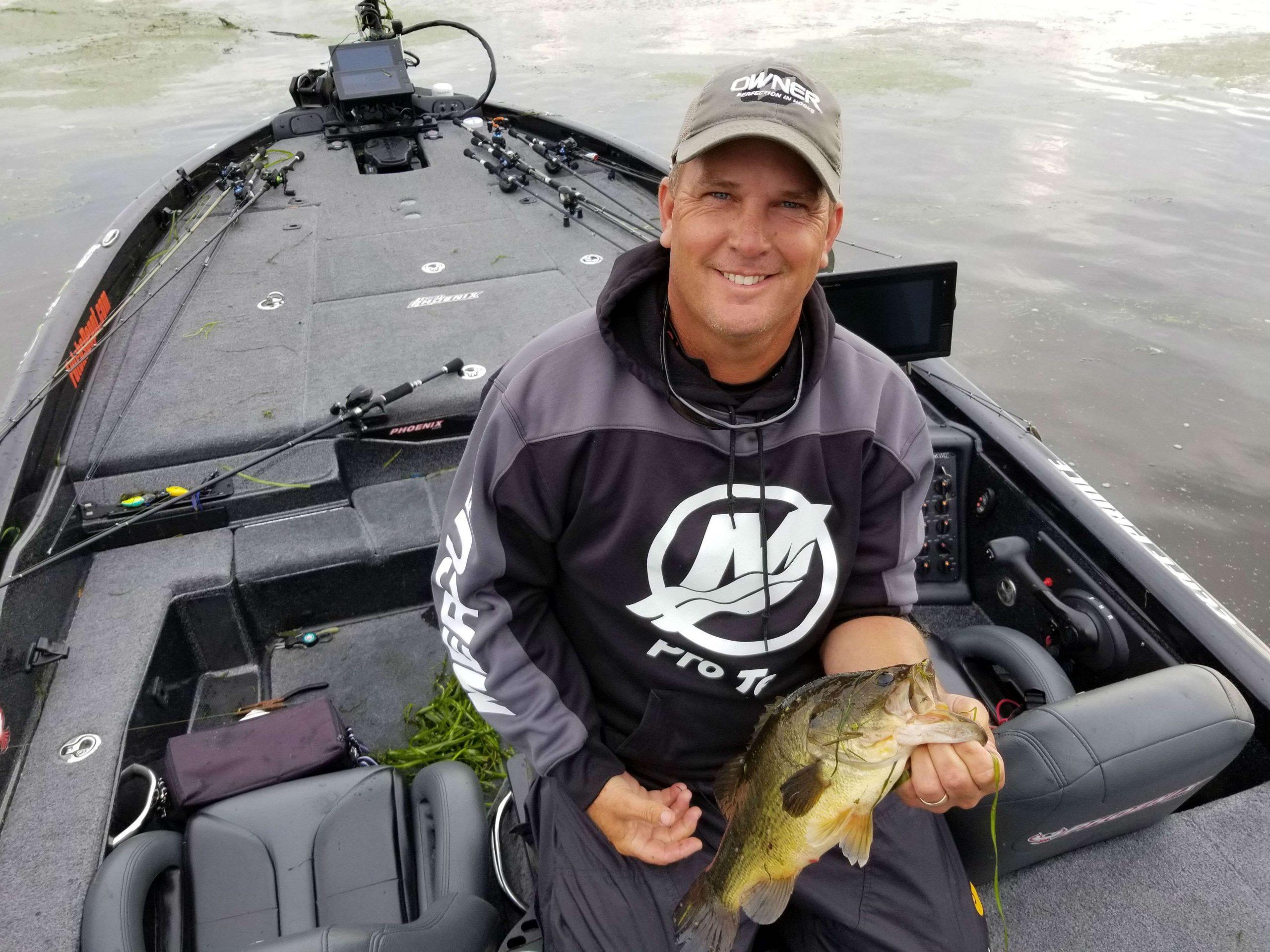 Cliff Prince with his third keeper of the morning, a solid Largemouth! He has been working this same grass mat for about an hour. He's switching baits often and getting steady bites. Prince caught one 3-pounder here and feels like there's more in the area. 
3-pounders are the 