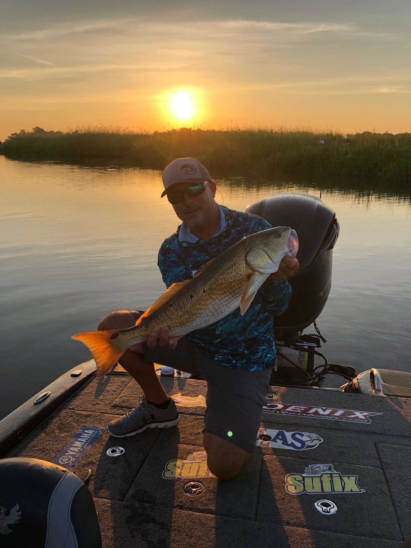 Early morning redfish action with Randall Tharp.