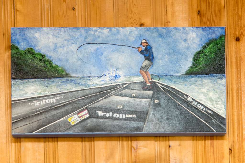 We caught up recently with Bassmaster Elite Series rookie Caleb Sumerall and got a tour of his tackle staging area at home. Family friend Kristin Stanberry painted this picture of Sumrall landing a bass. The scene was taken from a video of the event.