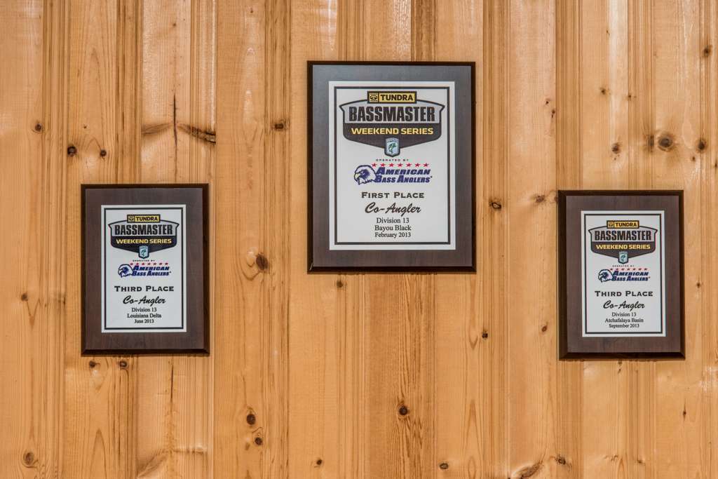 These plaques on his man cave walls commemorate his accomplishments on the Bassmaster Weekend Series.
