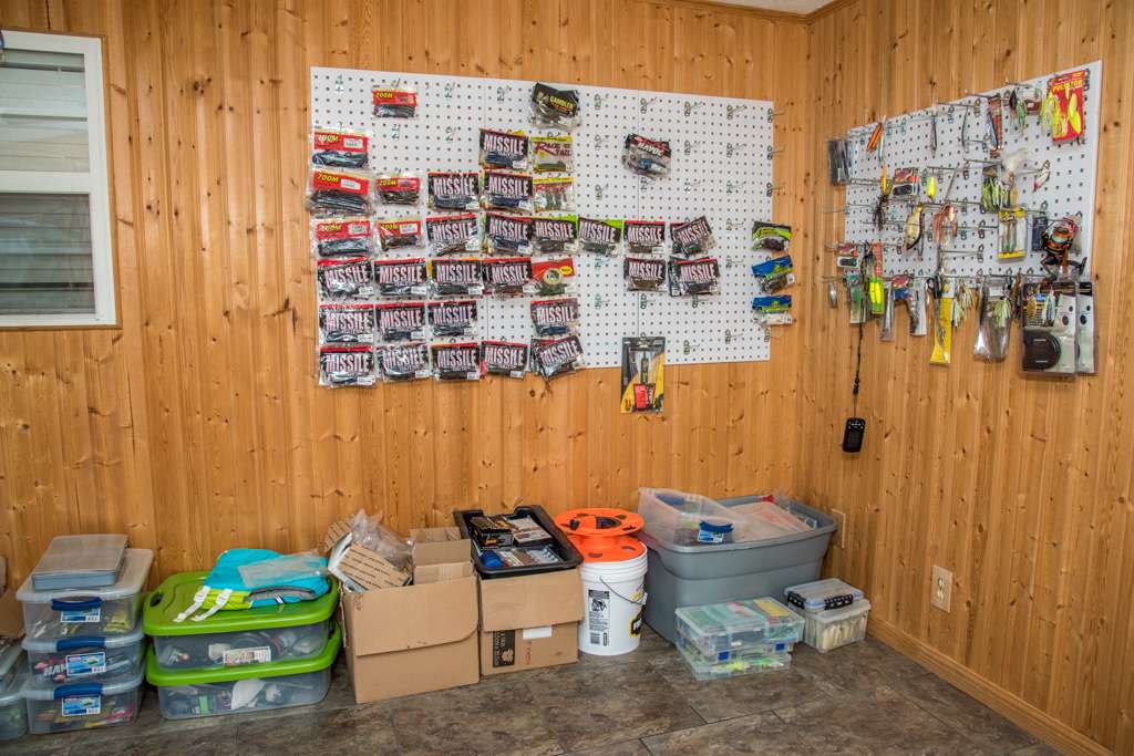 A corner of his man cave is dedicated to pegboards that will hold his reserve lures as he builds his stock up. Extra gear is held in bins and boxes.