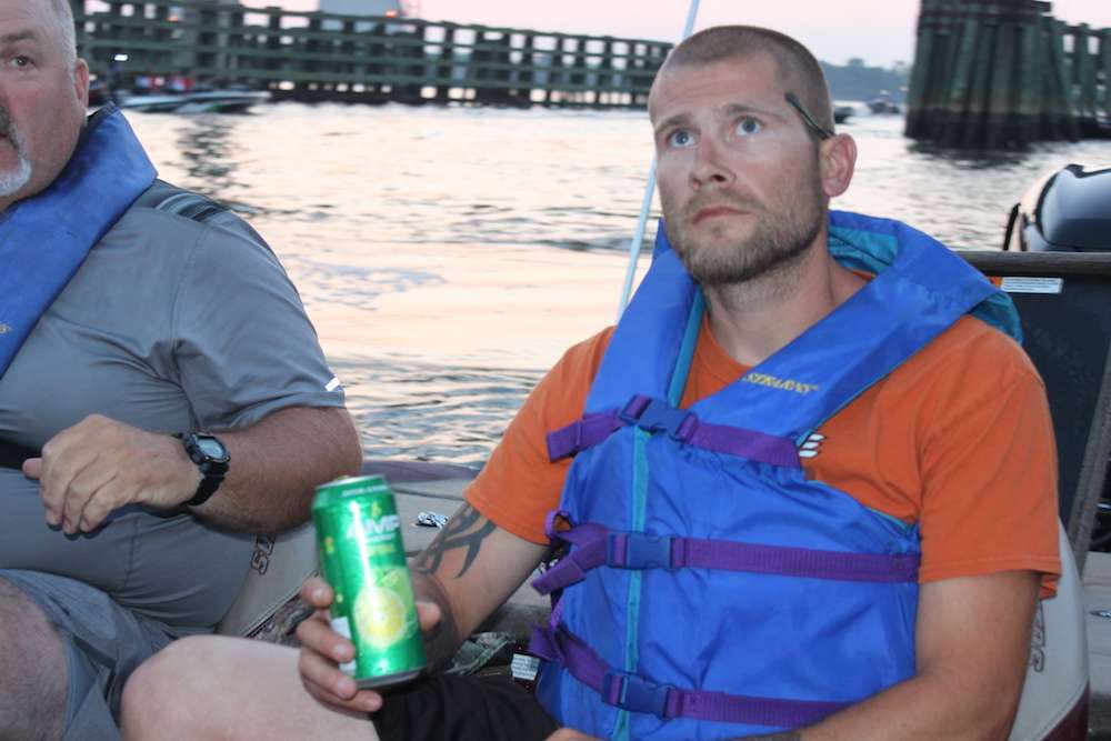 This angler has a can of adrenaline at the ready for the boat ride ahead.