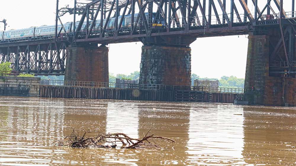 Commuters on the Amtrak train crossing the Susquehanna could see chocolate stained water and debris rushing under them.