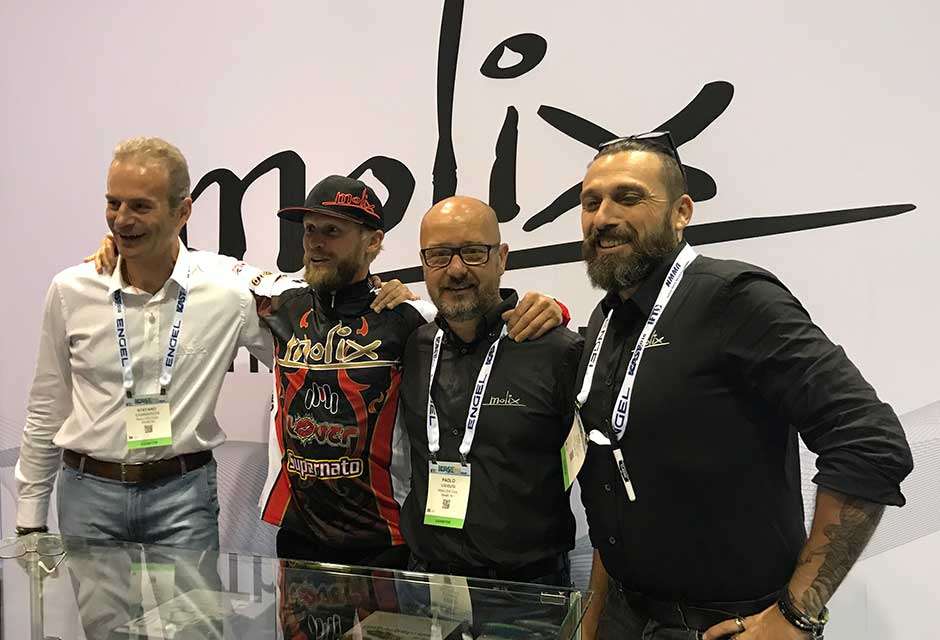 Bassmaster Elite pro James Elam poses at the Molix booth with the crew from Italy. The company has added several more Elites to its stable. Mike Iaconelli was the first -- say, where is Ike?