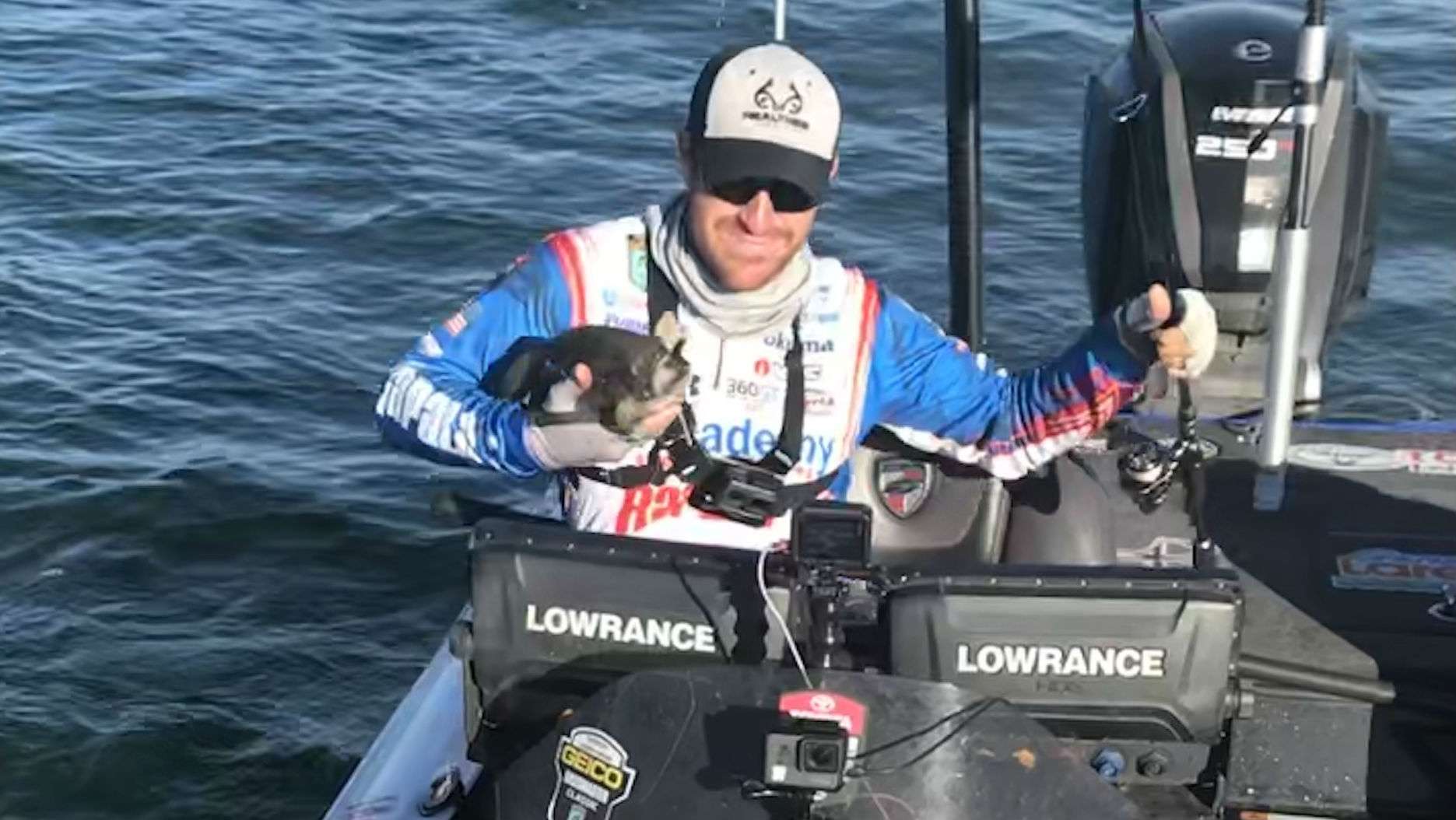 Wheeler gives his new friend a hug as he welcomes another bass into the livewell.
