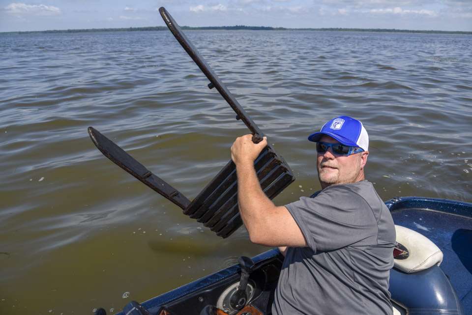 Our boat driver, B.A.S.S. life member Greg Ledwell, holds up the back of a chair drifting down the Chesapeake Bay. We saw a lot of such debris swept from areas normally high and dry.