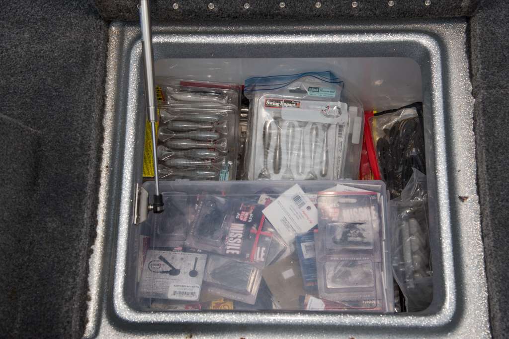 Extra weights and lures are organized inside the driver-side rear compartment.