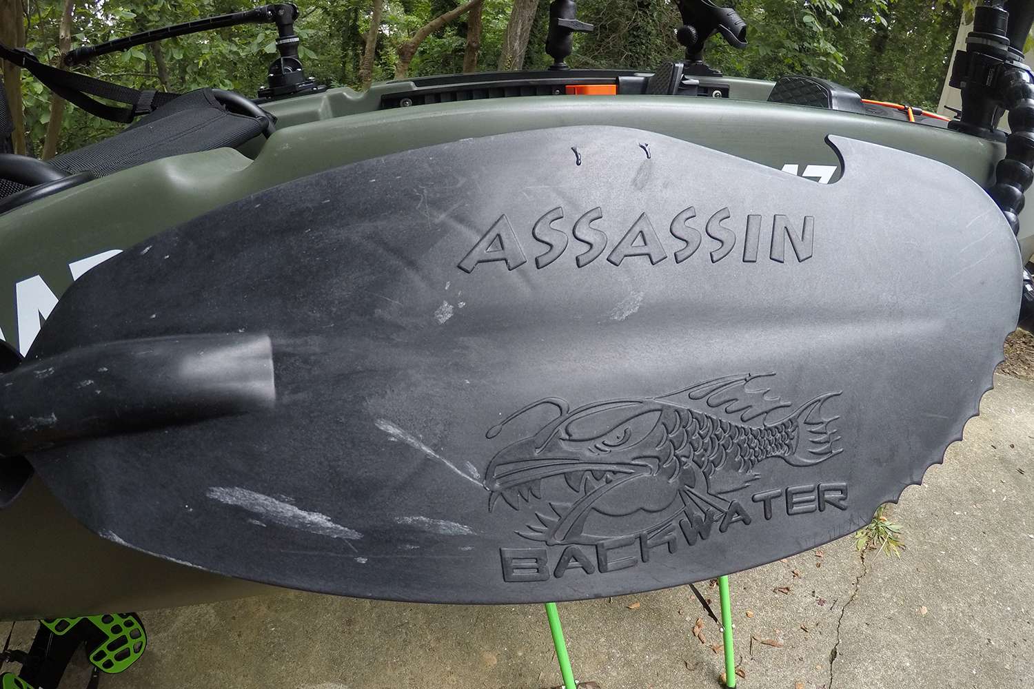 Conveniently attached to the side of the boat is a YakGear Backwater Assassin carbon fiber hybrid paddle. Built to break through vegetation and power and steer the kayak.