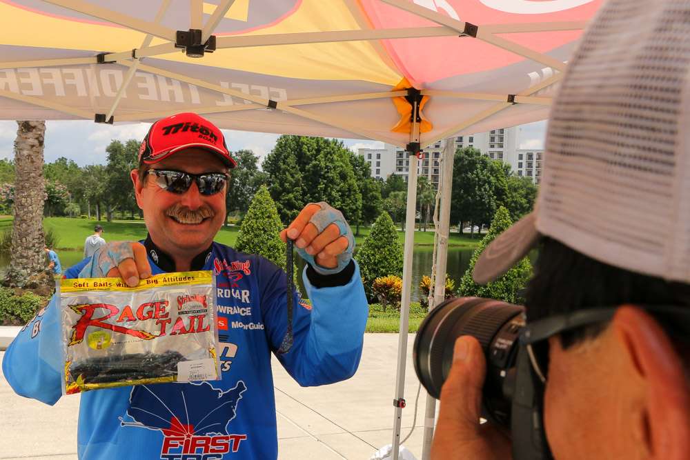 And then thereâs Shaw Grigsby, smiling as usual, giving media member Ron Wong a few shots of some new Strike King baits. 