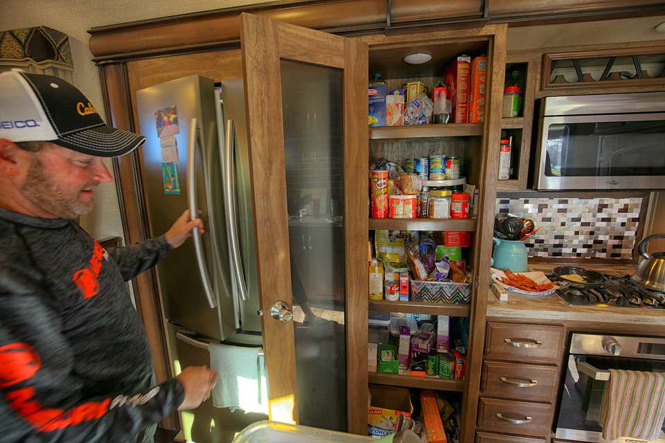 Mike gives us a look inside the pantry. Plenty of room for provisions for the busy couple who are spending 18 months living full time in the RV. 