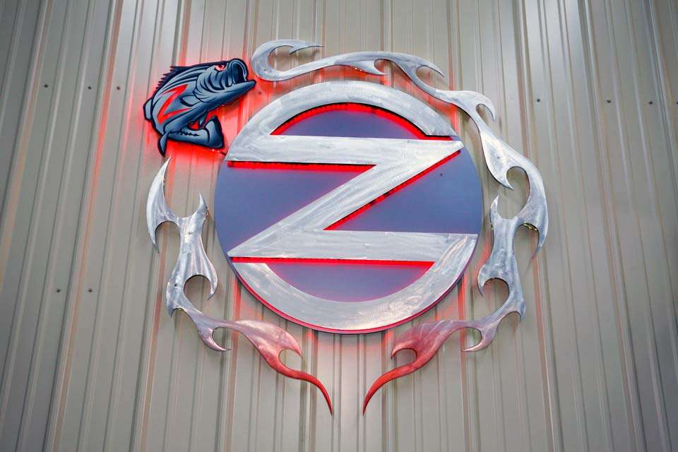 All the wall coverings are highlighted by Zonaâs logo. Itâs lit with LED lighting and according to Zona, âItâs crown jewel of all metal logos.â
