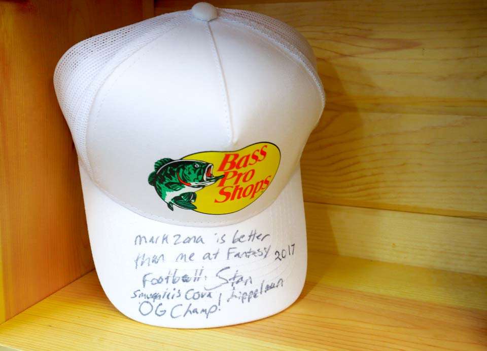 And as an ode to his obsession with fantasy football thereâs a Bass Pro hat pronouncing his skills and signed by Stan Lippleman of Bass Pro.
