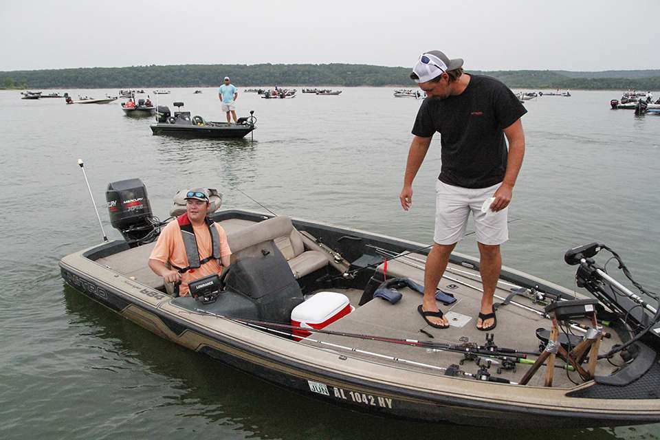 Two-time College Regional winner Josh Butts gets on the boat at the dock.