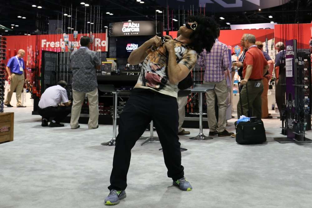 He showed me his patented moves, somehow hooking a monster fish right here at the Abu Garcia booth. 