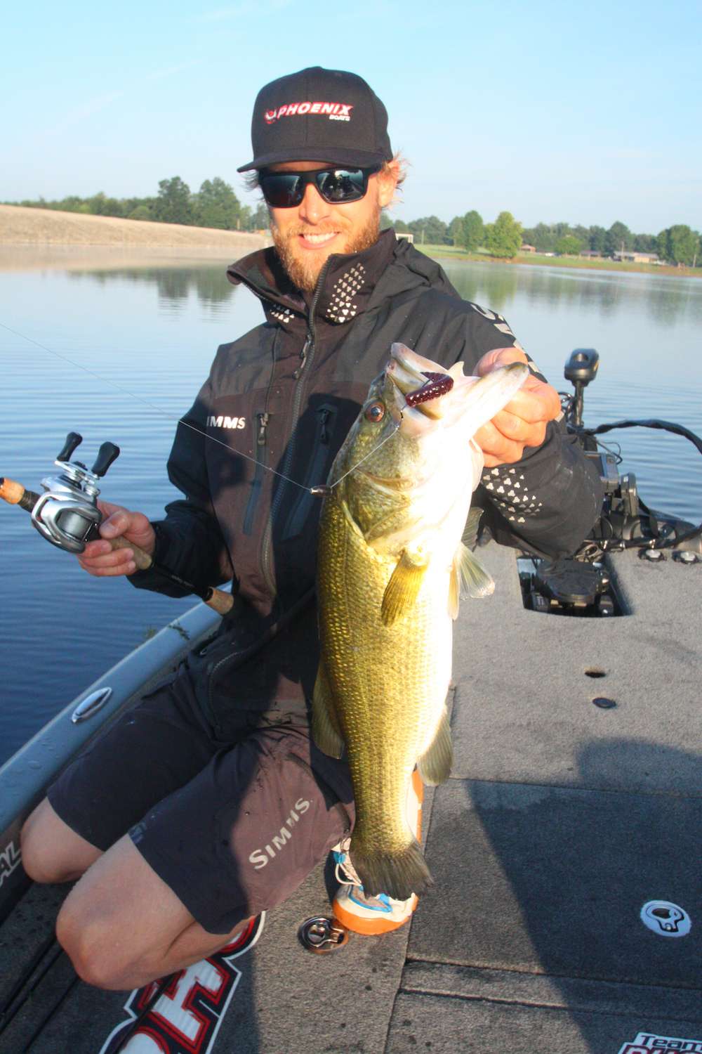 <b>7:40 a.m.</b> He works it to the boat and swings aboard his first keeper of the day, a long, lean largemouth weighing 4 pounds, 8 ounces. âThat fish was right at the edge of the grass.â<br>
<b>7:48 a.m.</b> Elam continues down the dam while casting the worm parallel to the structure. <br>
<b>7:55 a.m.</b> Elam idles back toward the boat ramp to drag a Chunk Craw along a deep channel point heâd graphed up after launching. <br>
<b>7:58 a.m.</b> He catches keeper No. 2, 15 ounces, on the craw. âThat fish was on a little flat that butts up to the point. It was 15 feet deep.â
<p>
<b>6 HOURS LEFT</b><br>
<b>8:01 a.m.</b> Elam switches to a chartreuse sexy shad Strike King 5XD crankbait and dredges it across the point. <br>
<b>8:08 a.m.</b> He moves to the opposite side of the point and drags the Power Worm. âThereâs grass growing down there to around 12 feet.â <br>
<b>8:15 a.m.</b> Elam tries a homemade 3/8-ounce green pumpkin/blue cone-head jig with a watermelon pepper Chunk Craw trailer on the point. âMy dad makes these jigs specifically for fishing grass. Weâve both caught some whales on âem.â
