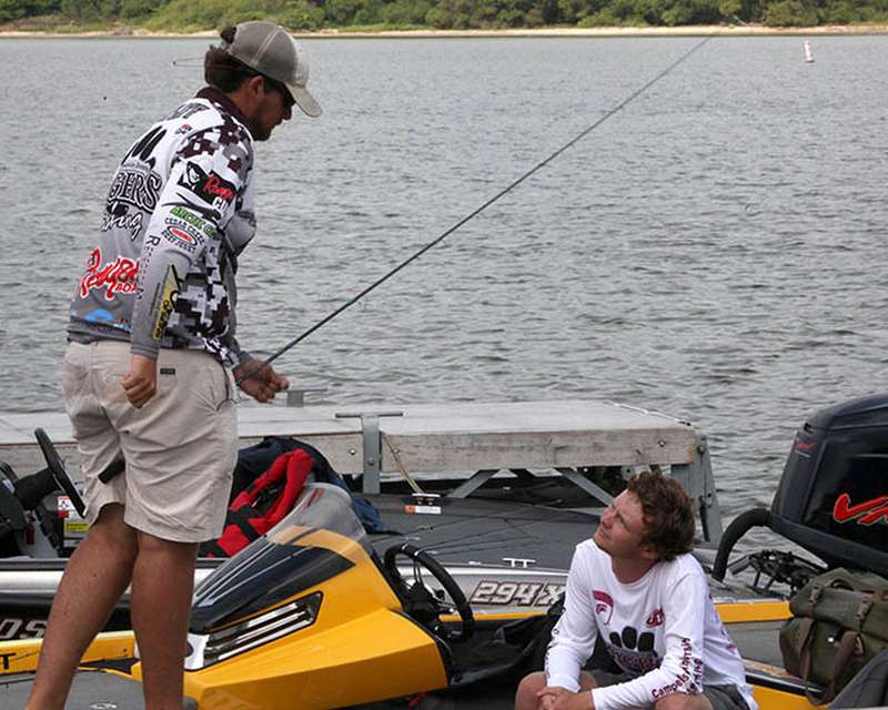 Campbellsville University teammate Bradley Dunagan joins Nick Ratliff on his boat.