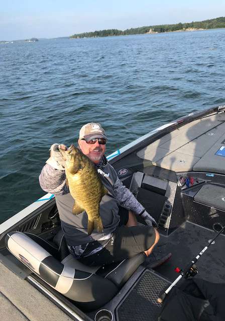 As I hit send on the last picture, he pulls in a three and a half pounder. Still not the size he's looking for, but at least this fish earned a smile from Keith Combs.