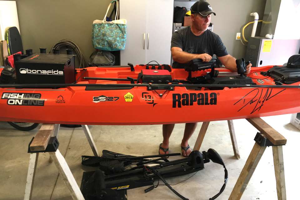 Bassmaster Elite Series pro Dave Lefebre overwinters his Bonafide SS127 Sit/Stand kayak by hanging it from the garage ceiling. During the fishing season, or anytime he's rigging and cleaning it, he rests it on dual conventional sawhorses.
