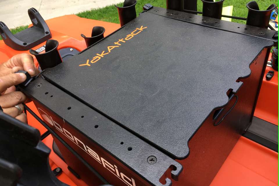 Purpose-built cords and clips lock the Kayak Crate securely to the hull.