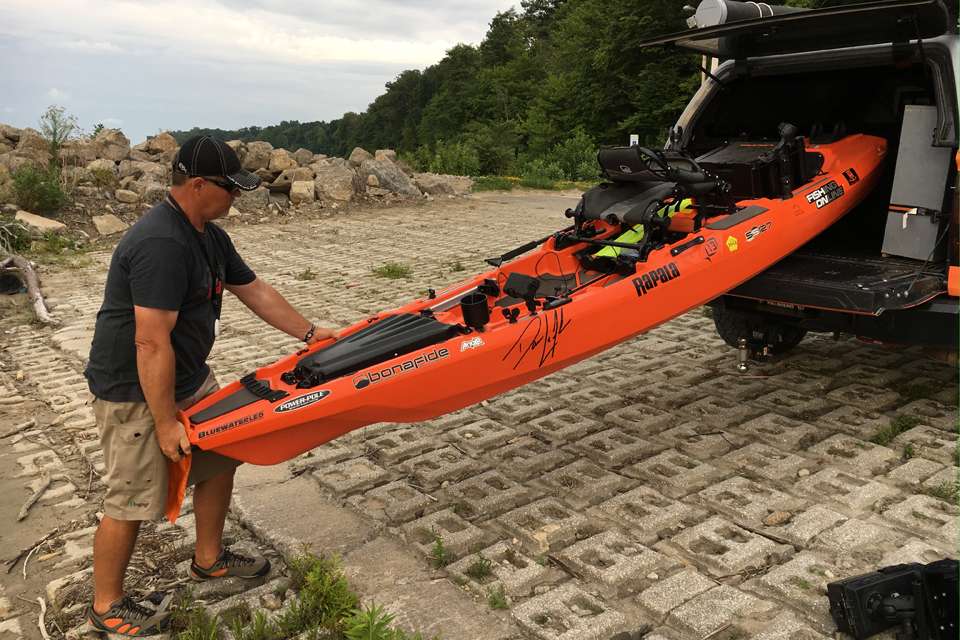Once at the water, Lefebre lowers the kayak out of the truck and onto the ramp. Again, the front and rear skids help protect the hull.